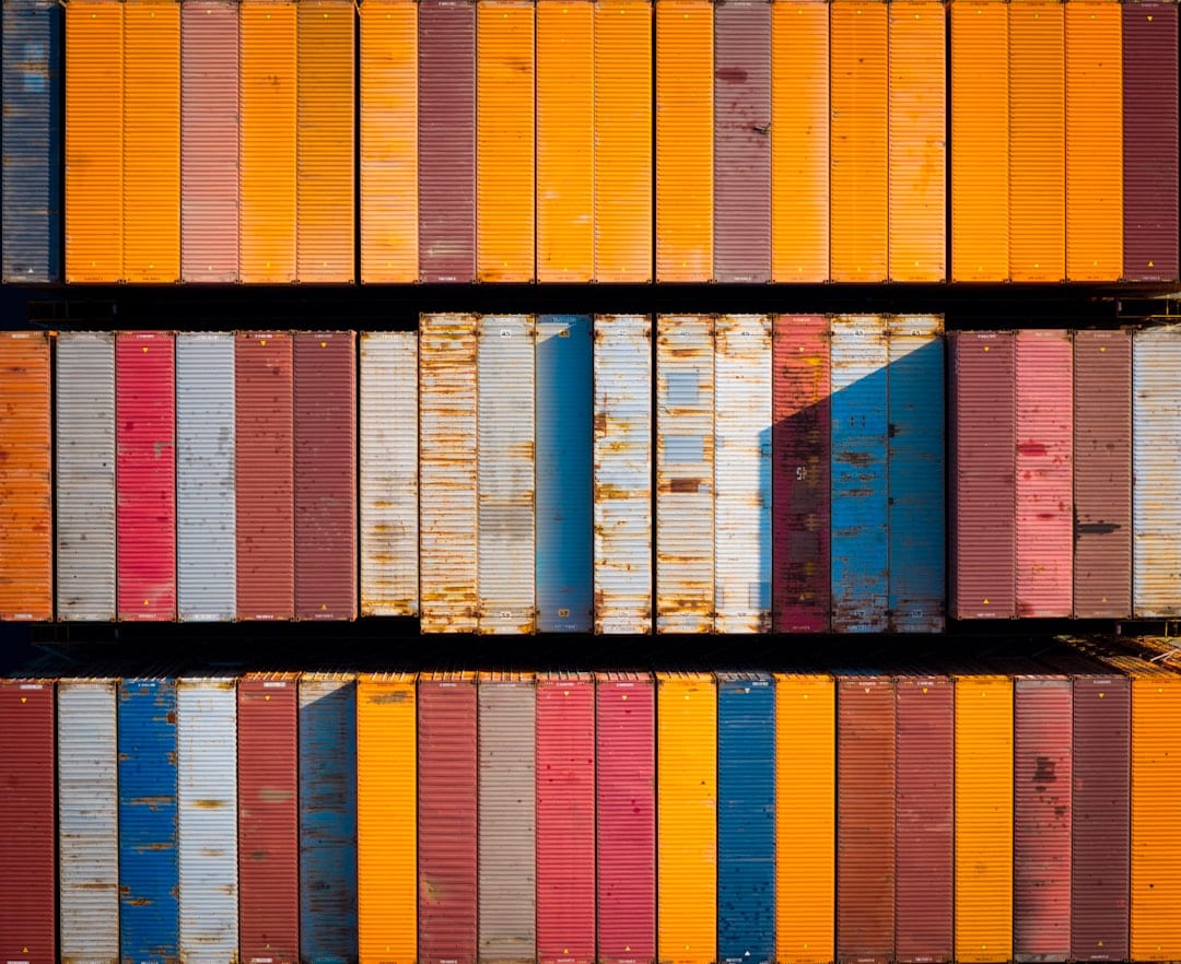 Aerial view of container ship deck with organized cargo containers